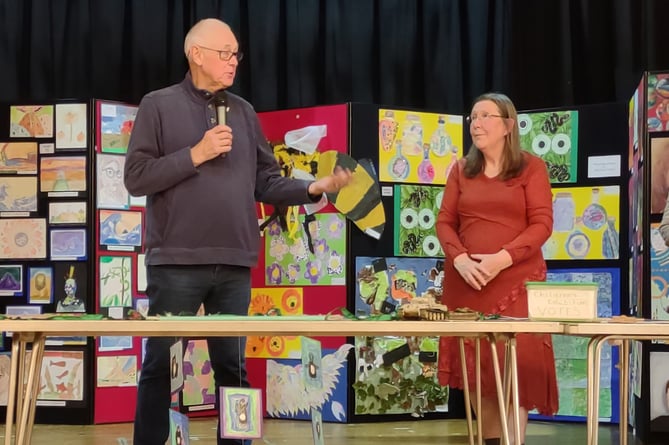 Exhibition secretary Kaye Garrett and artist Roger Dellar in front of the children’s work during the opening of the Alton Art Society’s annual exhibition at the preview evening on October 7th 2022.