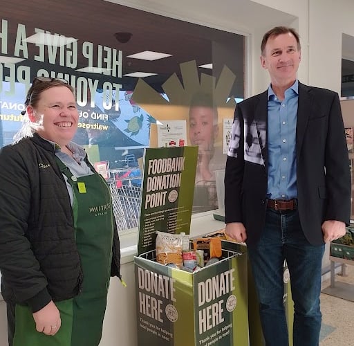 Alice Butcher, partner and community lead at Waitrose Farnham, with Jeremy Hunt on the MP’s recent visit to the Lion & Lamb Yard supermarket