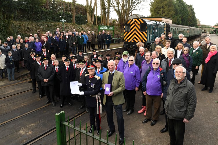 Volunteers who help maintain nd run the Watercress heritage railway that runs between Alresford and Alton in Hampshire have been awarded the Kings Award for volunteering.
 Pictured: Watercress President Richard Lacey holds the award whilst the Lord Lietenant for Hampshire Higel Atkinson holds the certificate awarded to the volunteers.Â©Russell SAch - 0771 882 6138