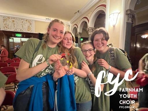 Farnham Youth Choir members celebrate with the trophy in Hull