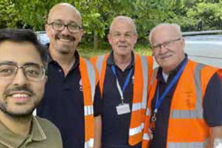 Cllr Adeel Shah and pothole fixers, St Lucia Park, Bordon, July 2023.