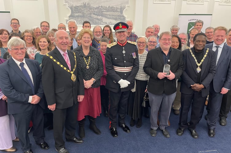 Volunteers and trustees of Farnham Repair Cafe receive the King's Award for Voluntary Service.