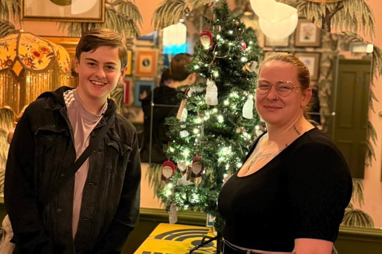 Joe Tully with Clavio general manager Tash beside the giving tree